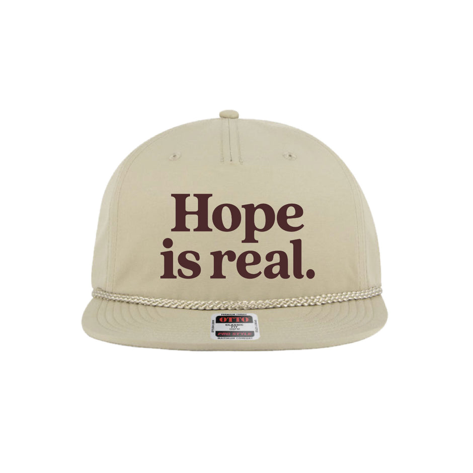 Beige cap with 'Hope is real.' text on a white background