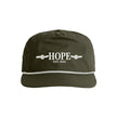 Green cap with 'HOPE EST. 2025' text on a white background