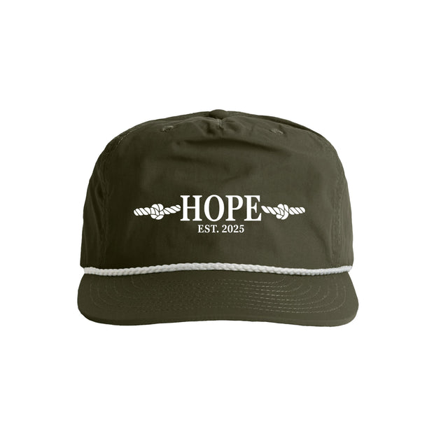 Green cap with 'HOPE EST. 2025' text on a white background