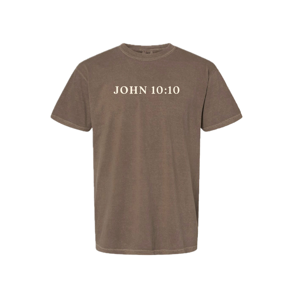 Brown t-shirt with 'JOHN 10:10' text on a white background